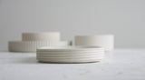 Modern ceramic white oval bowl with curved line pattern