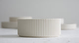 Ceramic small bowl in white with curved line pattern