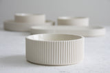 Ceramic small bowl in white with curved line pattern