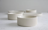 Ceramic small bowl in white with curved line pattern