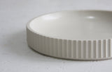 Ceramic large bowl in white with curved line pattern