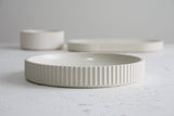 Ceramic large bowl in white with curved line pattern