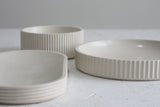 Ceramic small bowl in white with curved line pattern