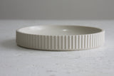 Ceramic large bowl in white with curved line pattern