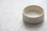 Ceramic small bowl in white with curved line pattern