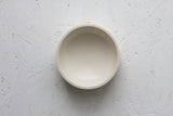 Ceramic small bowl in white with curved line pattern