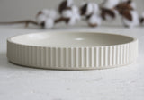 Ceramic large bowl in white with curved line pattern