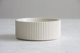 Ceramic small bowl in white with curved line pattern