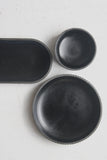 Modern ceramic black oval bowl in black curved line pattern