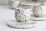 Eve - Ceramic espresso cup and saucer in white and black lines pattern