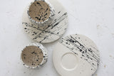 Eve - Ceramic espresso cup and saucer in white and black lines pattern