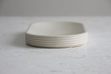 Modern ceramic white oval bowl with curved line pattern