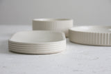 Modern ceramic white oval bowl with curved line pattern