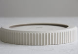 Ceramic large bowl in white with curved line pattern