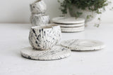 Eve - Ceramic espresso cup and saucer in white and black lines pattern