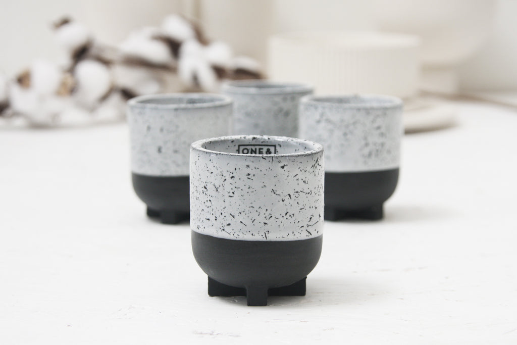 Plus - Ceramic espresso cup in black with white glaze and black dots- short